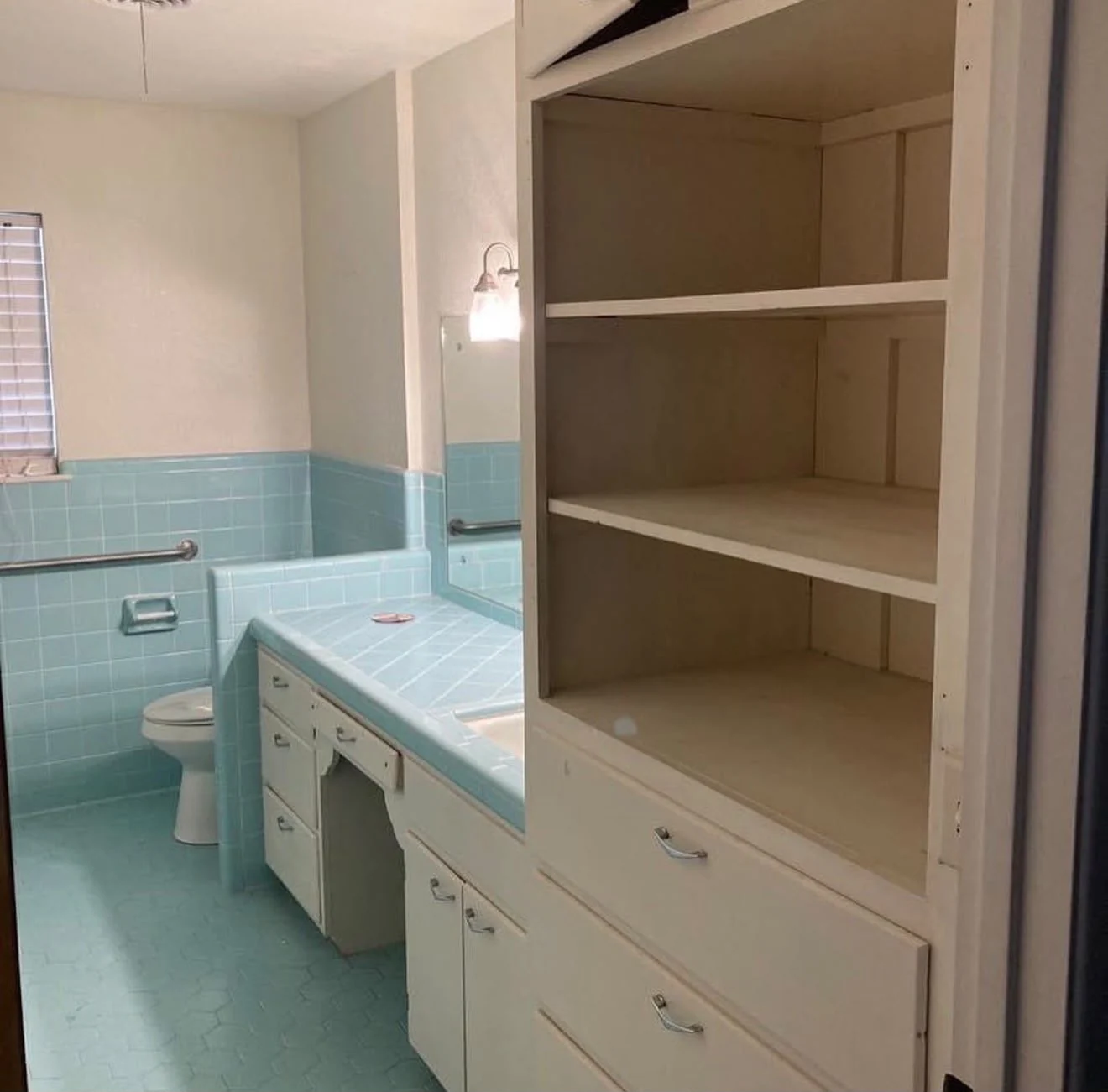 Bathroom vanity and storage before All Star Remodeling & Construction remodel