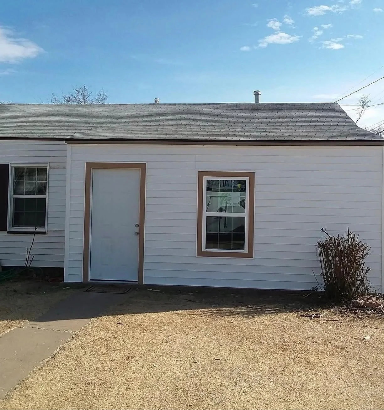 Exterior wall after All Star Remodeling & Construction siding and repair work